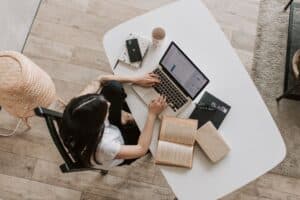 Person booking a luxury Calgary suite directly online on a laptop